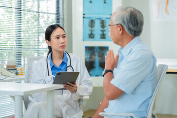 female doctor measures the blood pressure elderly male patient.health consultation, explains medication and prescription details, and offers emotional support. doctor-patient bonding.young profession