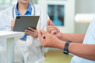female doctor measures the blood pressure elderly male patient.health consultation, explains medication and prescription details, and offers emotional support. doctor-patient bonding.young profession
