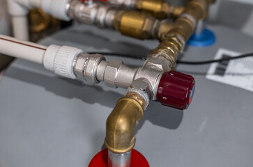 Technician plumber using a wrench to repair a water pipe under the sink. Concept of maintenance,...