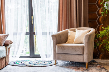Living room interior with mock up poster frame, beige sofa, round wooden coffee table, rug, pouf,...