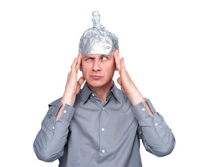 Suspicious man in gray shirt wearing aluminum foil hat, touching head with fingers. Transparent...