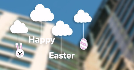 Showing white Easter clouds hanging over cityscape with Happy Easter text, bunny face, egg