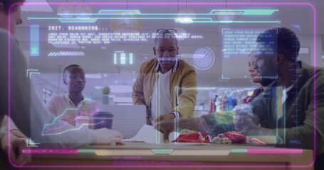 Leaning man in bomber jacket viewing neon holograms in meeting room with laptops documents mug pens