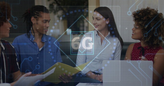 Reviewing documents on laptop, project team members collaborating in office lounge, with 6G overlay - Powered by Adobe