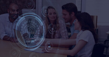 Professionals reviewing logs on laptop at office conference table with holographic fingerprint icon