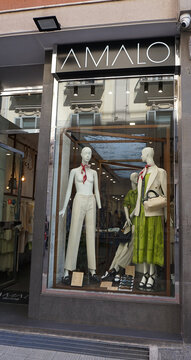 Bari, Italy - May 10, 2025: Amalo store Fashion Storefront with Mannequins and Sale Signs