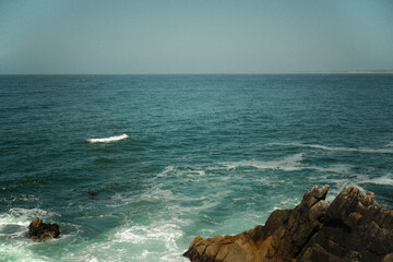 Crashing Waves on Rock Cliffs at Lover's Point Beach in Coastal California