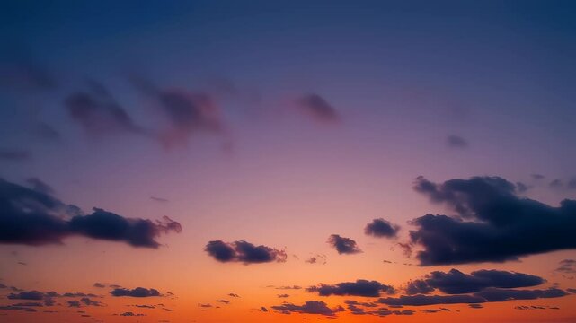 A slow pan across a breathtaking sunset, the sky ablaze with fiery oranges and deep purples