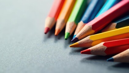 Abstract swirl of colored pencils, grey background Close-up, high contrast image , twisted, vibrant, design