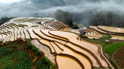 Water season flows into terraced fields and rice planting begins in Mu Cang Chai, Yen Bai. Photo...