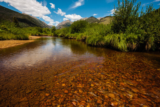 The peaceful Fall River, dancing across the shallow rocks, as it exits Endo Valley, near Horseshoe Park in Rocky Mountain National Park, Colorado in late July