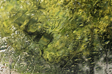 rain and tornado while driving on the road on the windshield. natural disaster