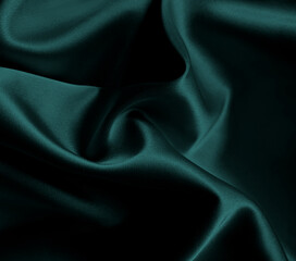 Luxurious cold dark blue fun british racing emerald green silk fabric with elegant, flowing drapes...