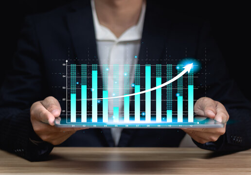 Business data analytics research concept, report graph dashboard monitor and financial investment planning.Analyzing business data graphs on grid background.