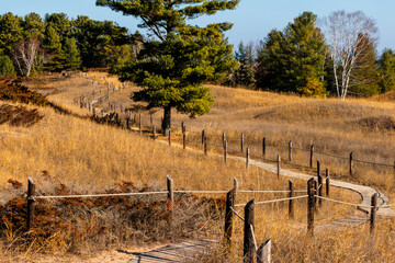 The winding, floating cordwalk safely leads over the sand dunes within Kohler-Andrae State Park, Sheboygan, Wisconsin in early November