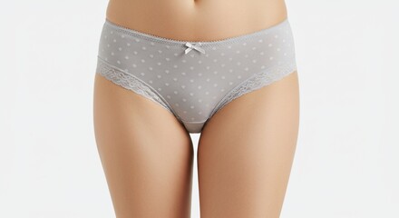 Woman wearing gray panties with hearts pattern and lace trim.