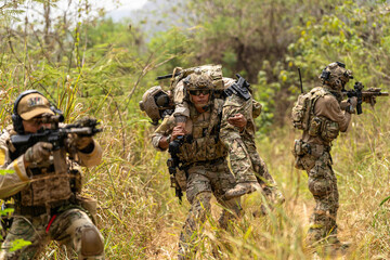 Soldier Carrying Injured Comrade During Tactical Combat Mission – Military Rescue Operation in...