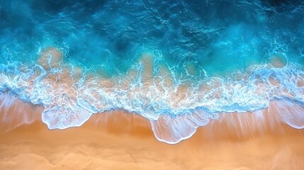 Fototapeta premium Aerial view of turquoise waves crashing on golden beach