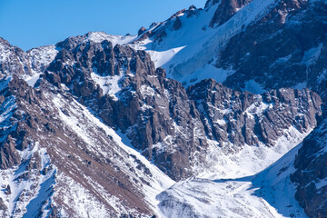 View of the winter peak Nursultan (Komsomol) from the top of Kumbel peak not far from Almaty.