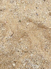 Rough natural brown and yellow granite stone wall texture with abstract sand patterns
