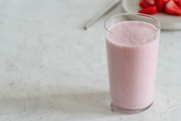 Summer refreshing cold drink, strawberry milkshake in glass