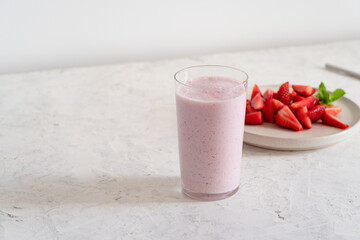 Summer refreshing cold drink, strawberry milkshake in glass