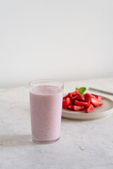 Summer refreshing cold drink, strawberry milkshake in glass