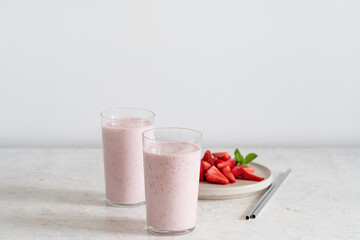 Summer refreshing cold drink, strawberry milkshake in glass