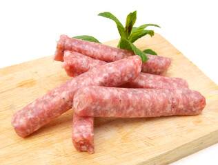 Raw meat sausages isolated on white background 