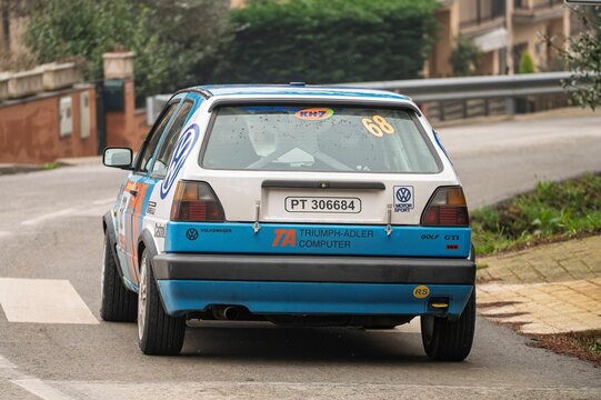 Rear view of a Volkswagen Golf GTI 1.8 16V rally car, number 73