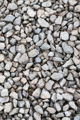 Gray natural stone wall texture with abstract rock and pebble patterns