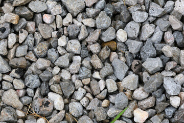 Gray natural stone wall texture with abstract rock and pebble patterns