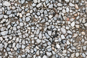Gray natural stone wall texture with abstract rock and pebble patterns