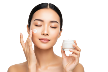 Close-up of woman applying face cream for healthy glowing skin