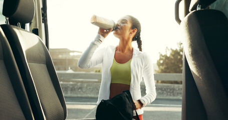 Fitness, drinking and smoothie with woman in city for workout, protein shake and training. Health,...