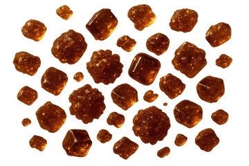 Fototapeta premium Pile of dark brown sugar cubes isolated on a transparent background, sweet