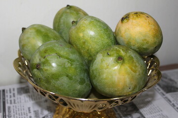 Ripe and fresh mangoes in basket.