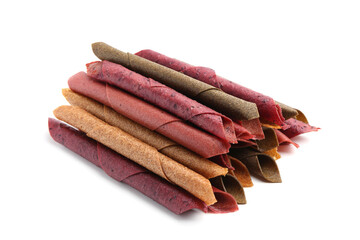 Delicious fruit leather rolls on white background