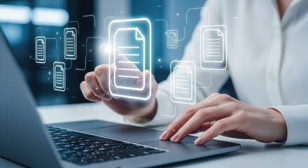 Businesswoman accessing digital documents and files on a laptop with modern cloud computing concepts and technologies for data storage and management