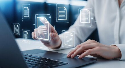 Digitally enhanced document management and cloud data integration concept with a person using a laptop computer