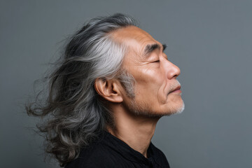 Obraz premium Hyperrealistic portrait of a handsome Japanese gentleman showcasing elegance and modern style in stunning detail