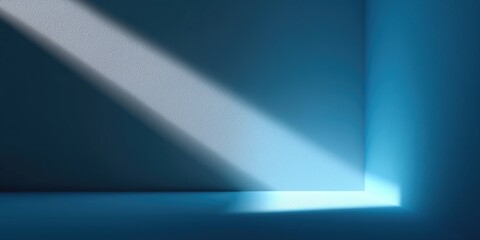 Minimalist interior scene with blue - toned walls and floor, highlighted by diagonal light beam casting sharp shadow, forming geometric pattern, smooth texture, and serene ambiance