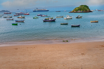 The idyllic Praia do Canto, Canto Beach, with its clear, calm waters and its fishing and tourist...