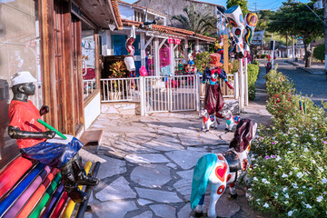 Handcraft store with wood handmade doll on the edge of Canto beach, Buzios, RJ. Brazil, January 2022