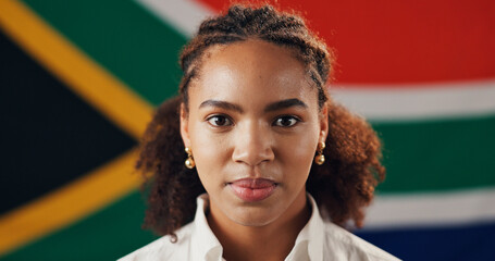 Portrait, woman and South African flag for culture, heritage or national pride with support. Face,...