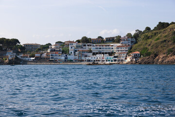 Sailing boat approaching Cala Margarida in Palamos, Costa Brava, Spain