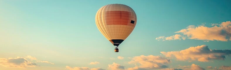 Naklejka premium Hot air balloon soaring in pastel sky