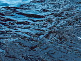 Captivating Deep Blue Water Surface with Dynamic Ripples and Reflections – An Alluring Aquatic Scene Perfect for Nature Art and Calming Backdrops