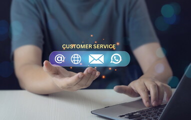Customer Service Support Concept with Businessman Holding Digital Contact Icons.businessman’s hands are holding floating digital contact icons including email, phone, and chat