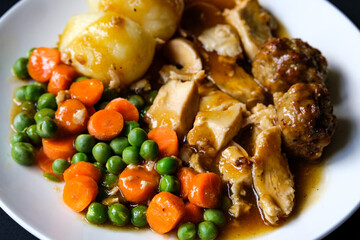 Traditional British Favourite Roast Chicken Sunday Meal With Vegetables And Stuffing
